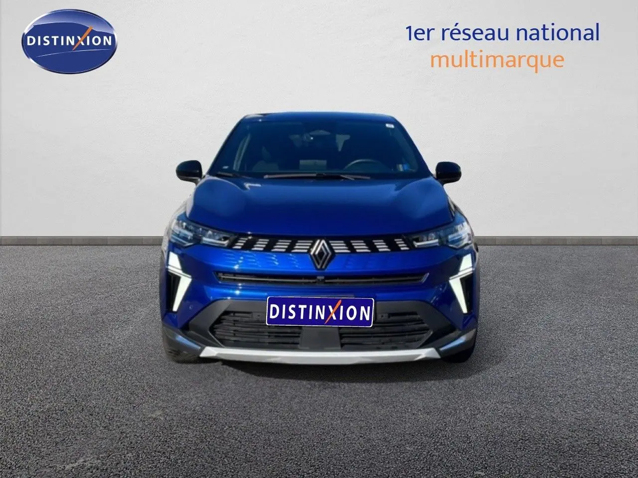 Vue avant d'une Renault Symbioz 2025 bleu iron metal avec calandre lumineuse et éclairage LED distinctif.