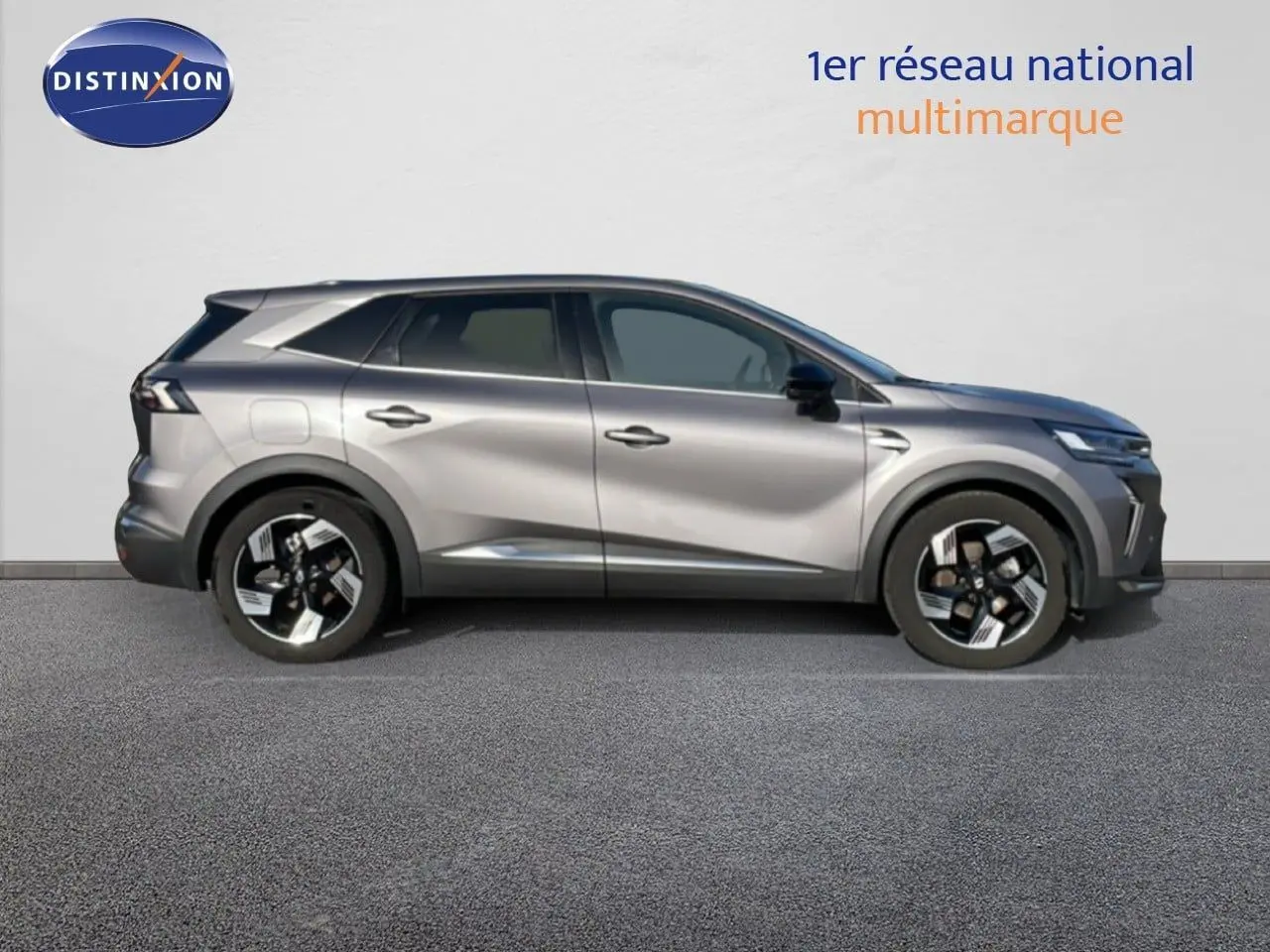Profil droit du Renault Symbioz gris cassiopée métal 2025 avec jantes alliage noires et design moderne.