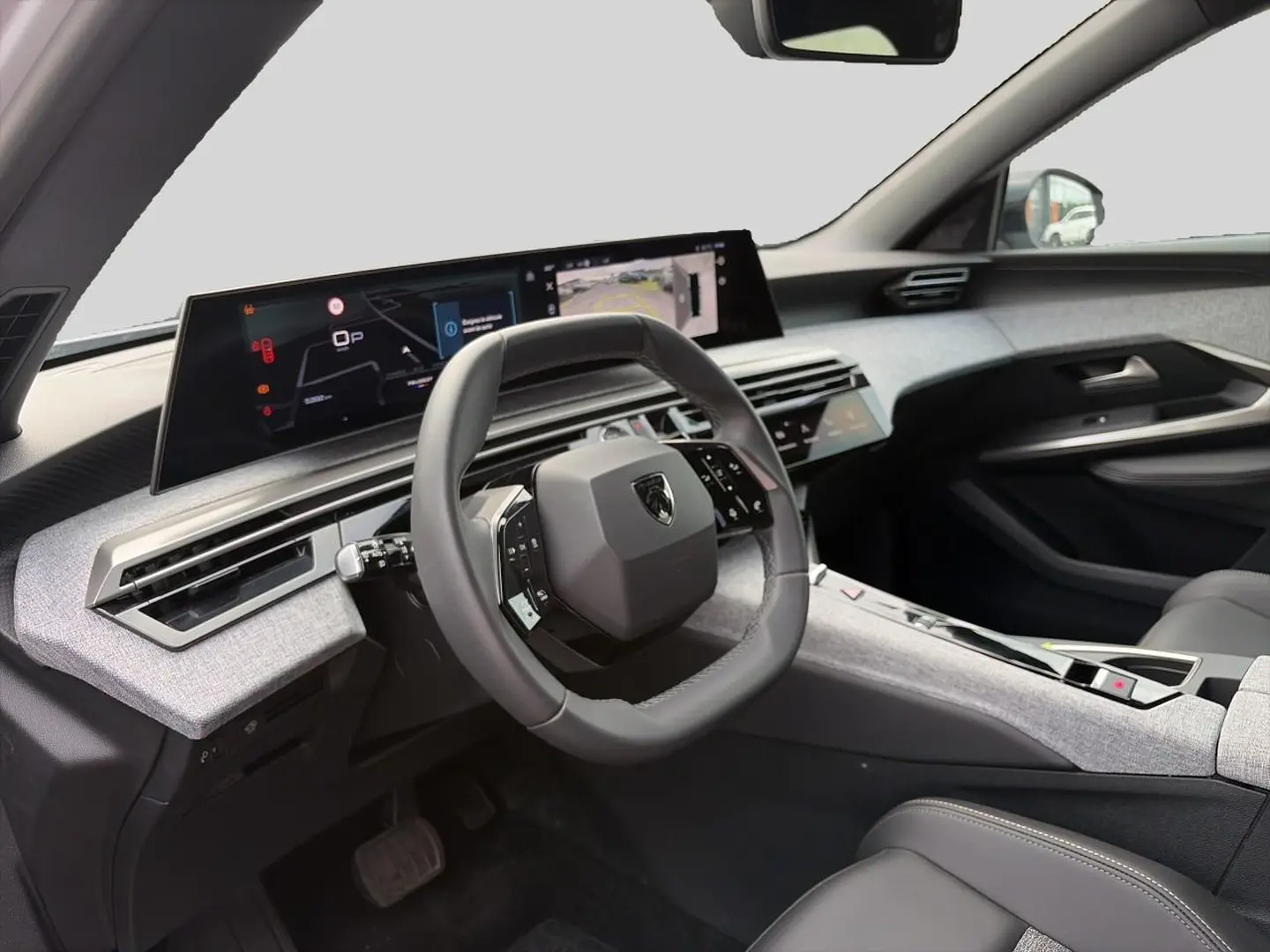 Vue intérieure côté conducteur du Peugeot 5008 Hybrid 145 allure e-dcs6 2025, volant cuir et tableau de bord numérique.