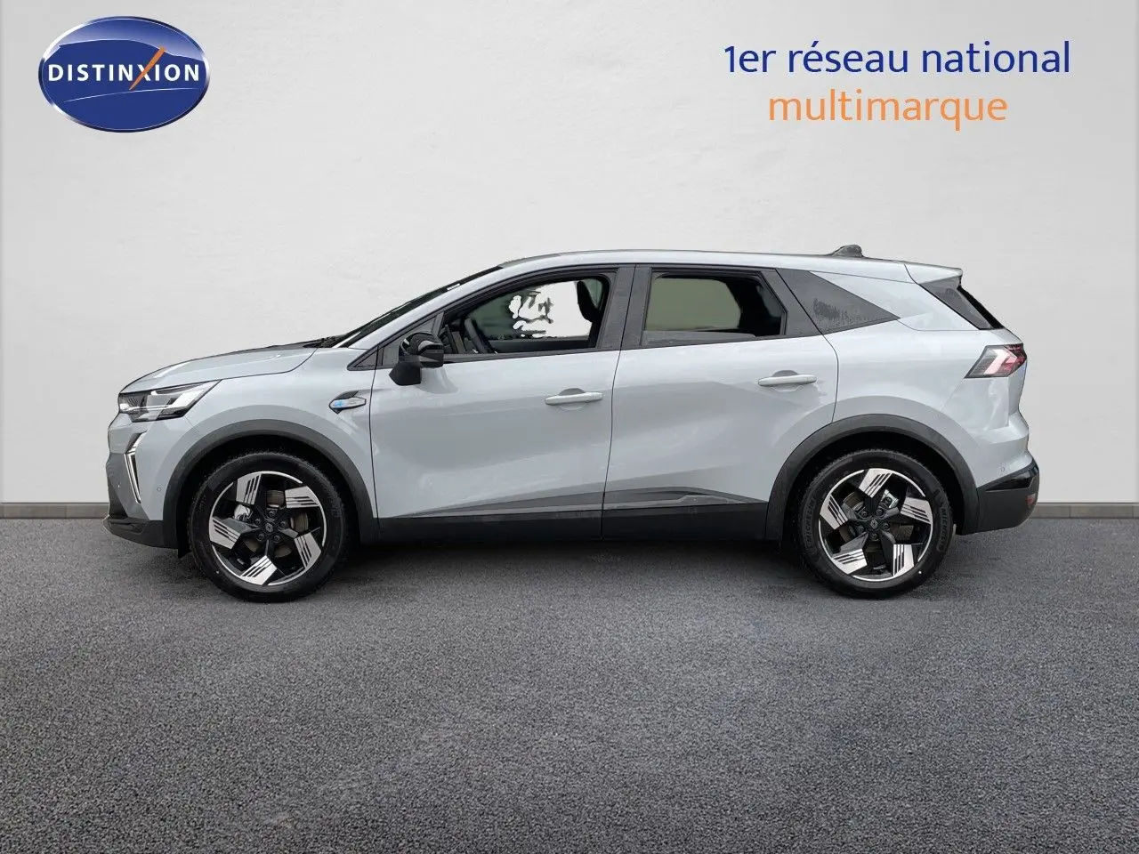 Profil droit du Renault Symbioz gris Rafale Métal 2026, SUV hybride avec jantes noires et argent modernes.