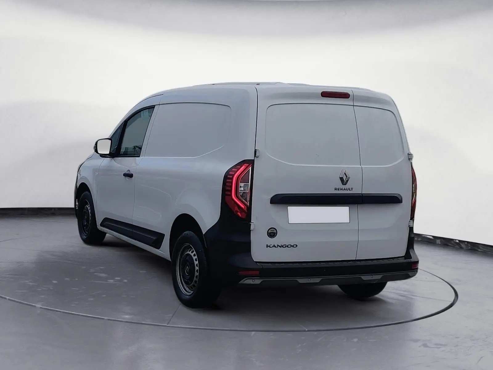 Vue 3/4 arrière droite d’un Renault Kangoo blanc utilitaire, avec portes arrière pleines et feux LED distinctifs.