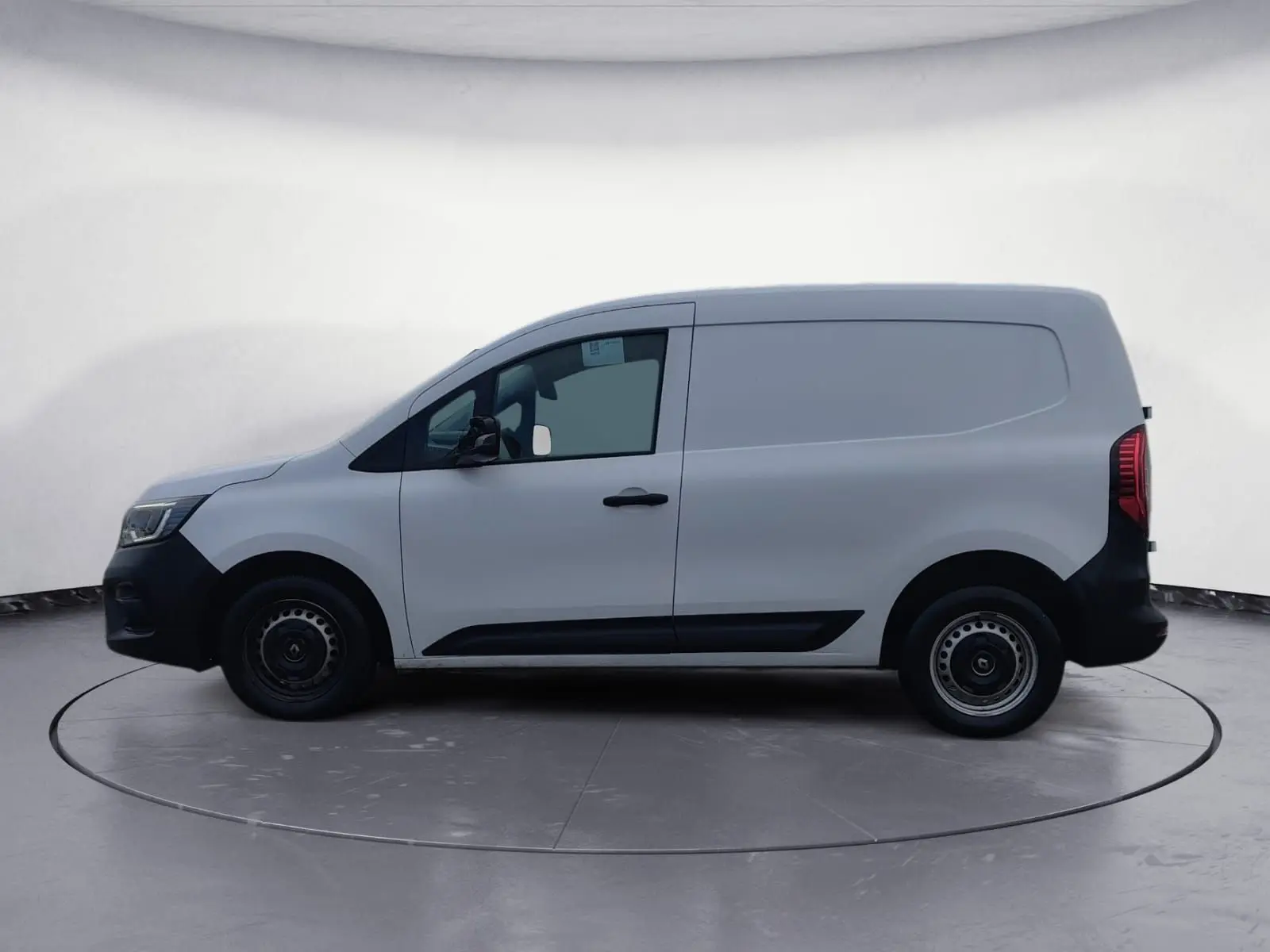 Vue de profil côté gauche du Renault Kangoo blanc 2022, fourgon utilitaire avec portes latérales lisses.
