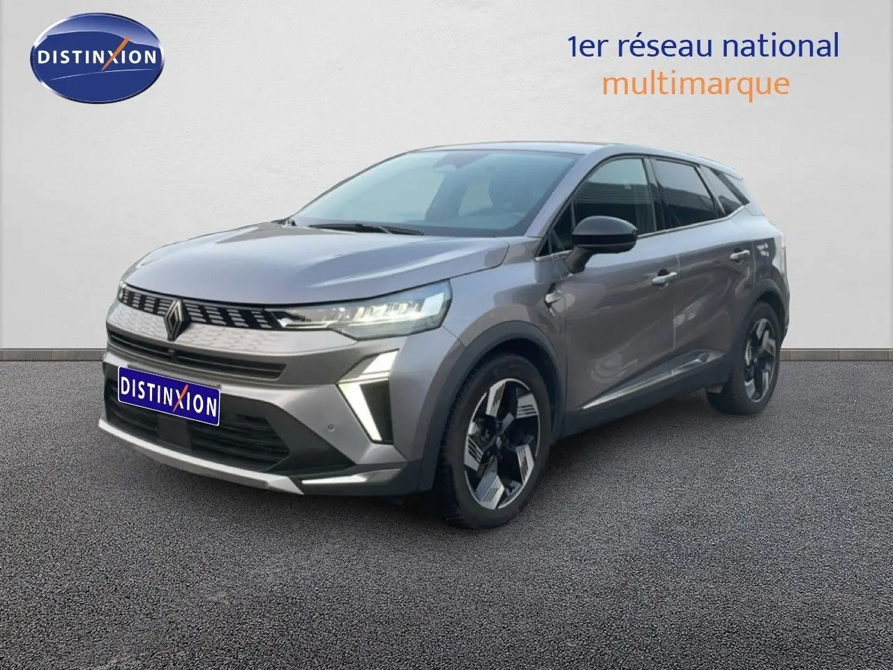 Renault Symbioz E-Tech gris cassiopée, vue 3/4 avant droit, SUV hybride avec feux LED et jantes bi-ton.