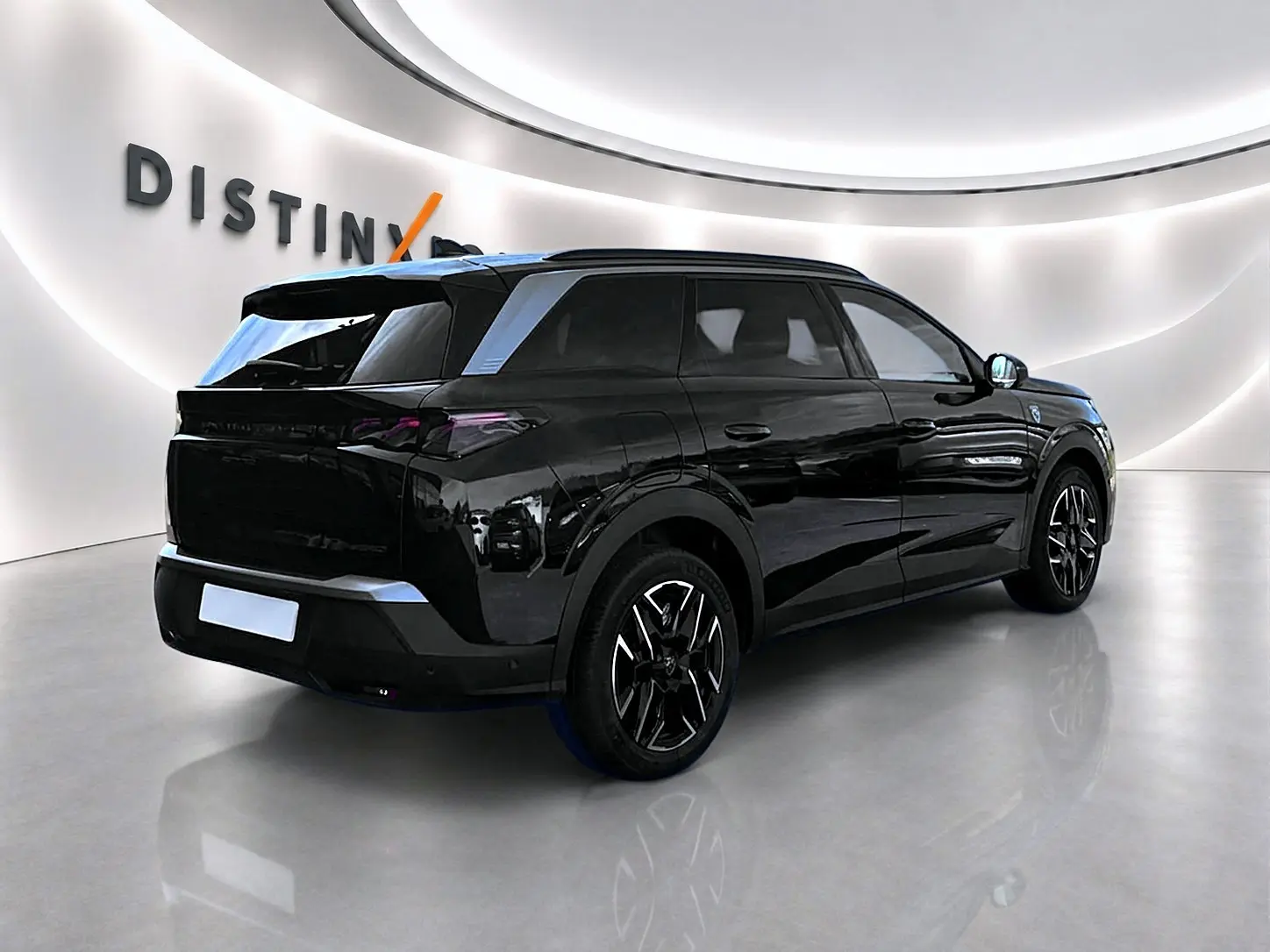 Peugeot 5008 Hybrid 145 GT noir, vue 3/4 arrière droit, jantes alliage et vitres surteintées visibles.