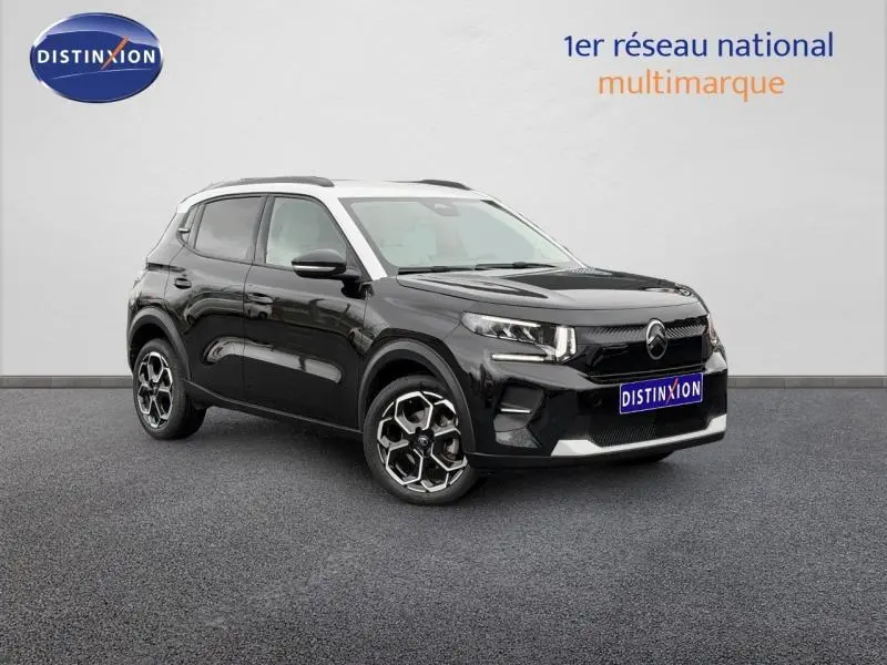 Citroën C3 1.2 Turbo 100ch MAX noir Perla Nera vue 3/4 avant droit avec jantes distinctives et toit blanc.