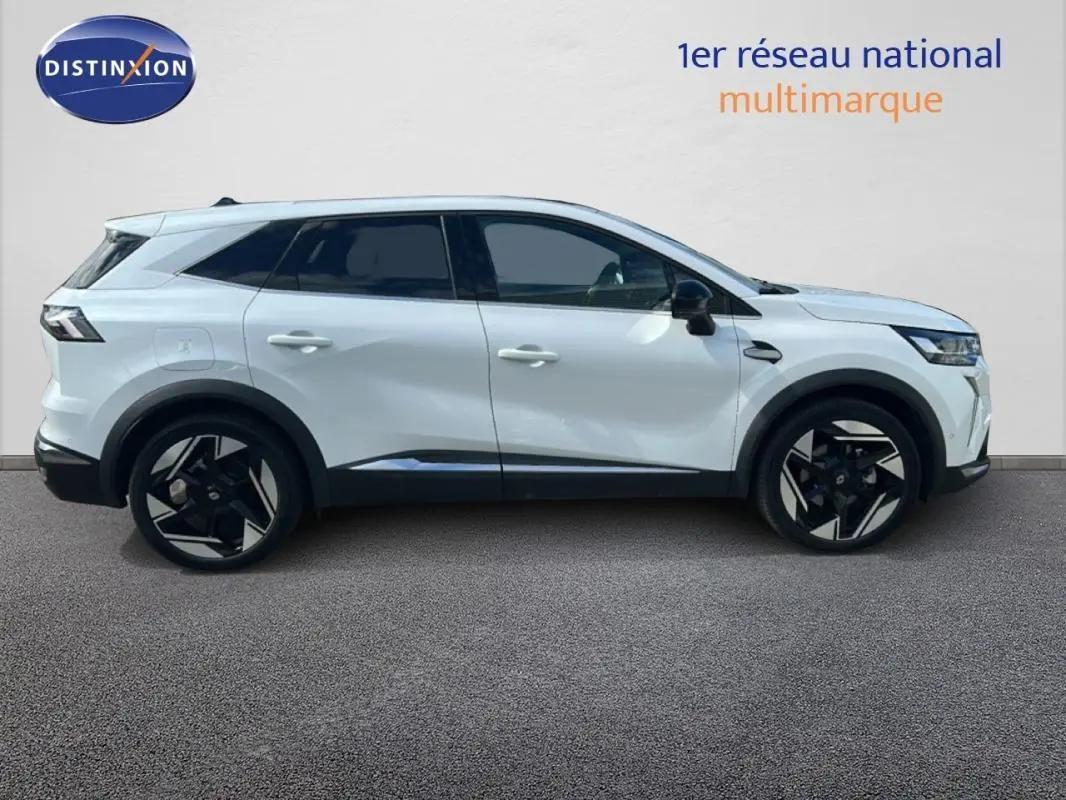 Profil droit d’un Renault SYMBIOZ blanc 2025 avec jantes alliage noires et toit noir contrasté.
