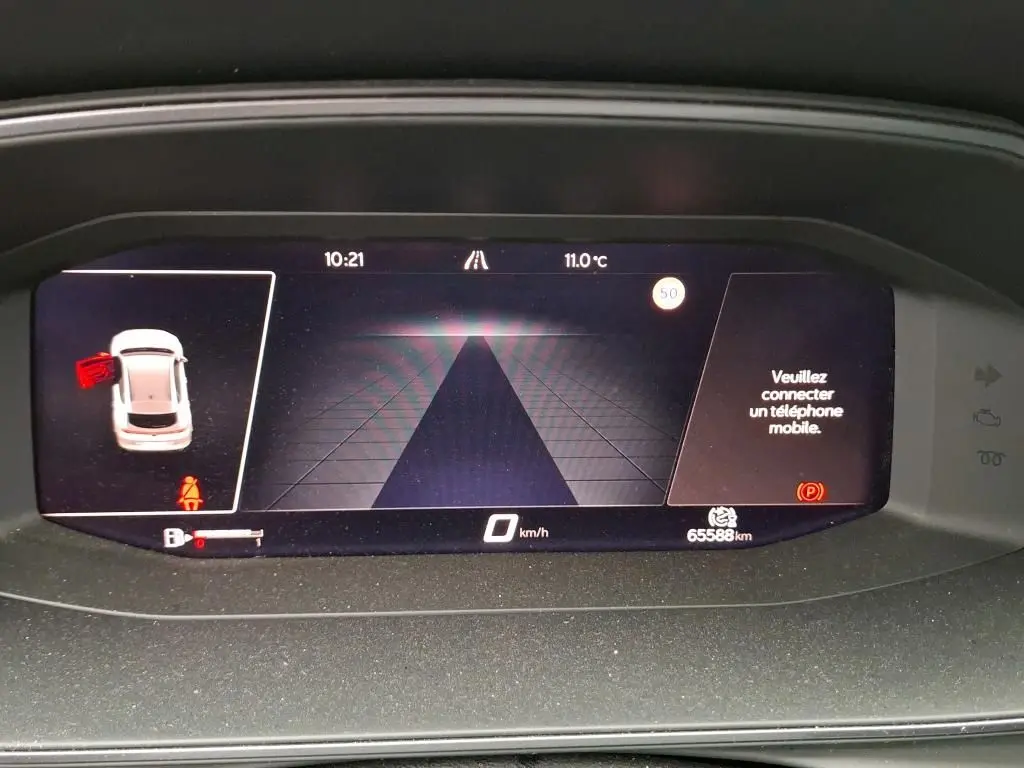 Affichage numérique du tableau de bord du CUPRA Formentor noir, montrant la vitesse à 0 km/h et une porte ouverte.