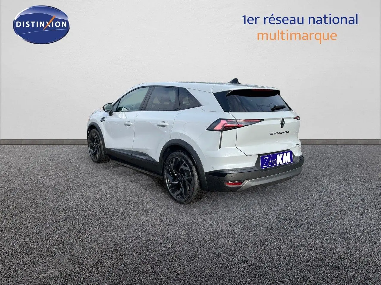 Vue 3/4 arrière droite du Renault Symbioz gris rafale avec jantes noires et feux arrière LED distinctifs.