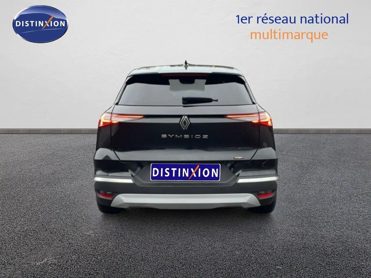 Vue arrière du Renault Symbioz noir étoile métal 2025 avec feux LED étirés et logo central lumineux.