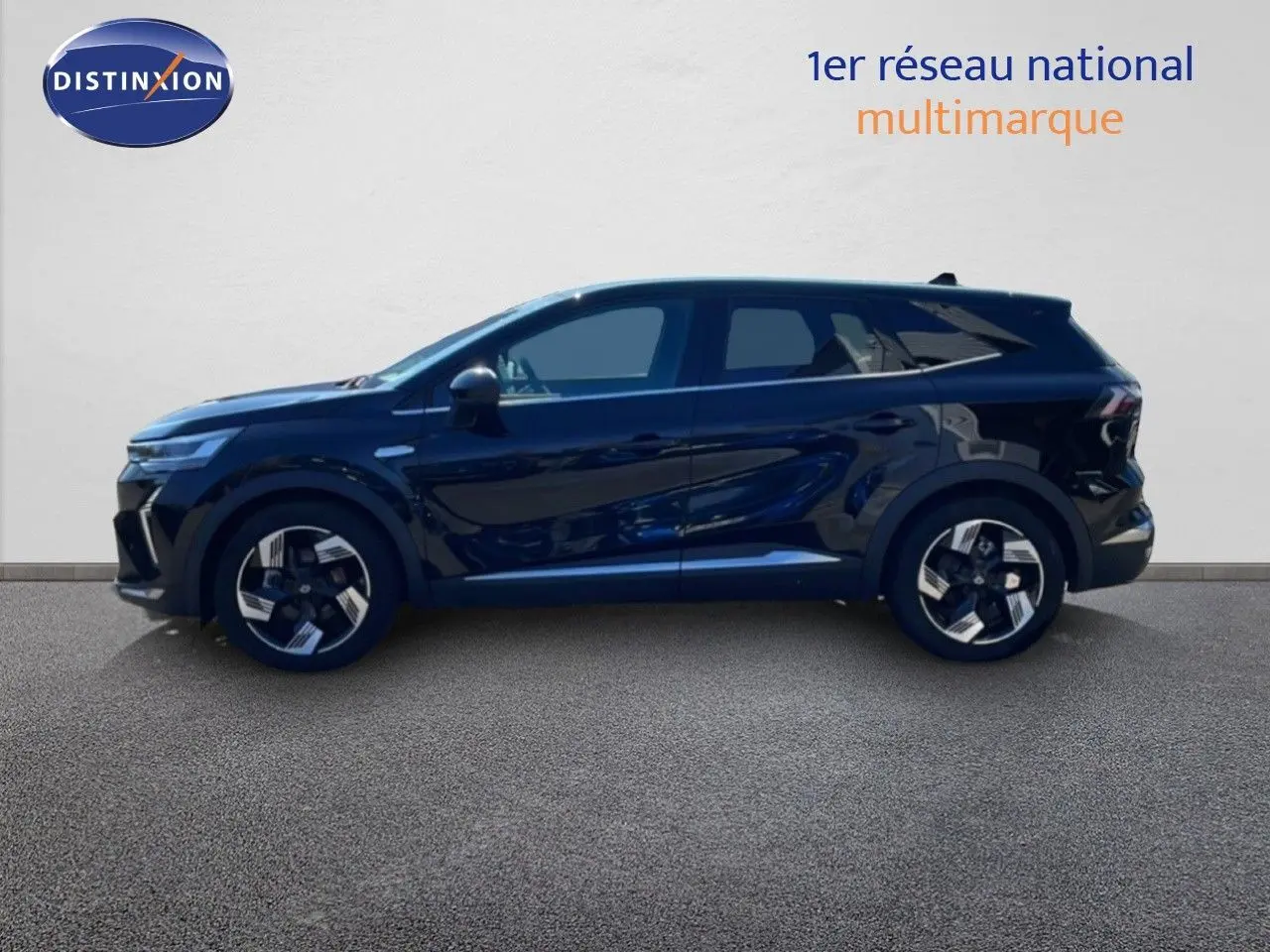 Profil droit d'un Renault Symbioz 2025 noir étoile métal, mettant en valeur ses lignes fluides et ses jantes bicolores.