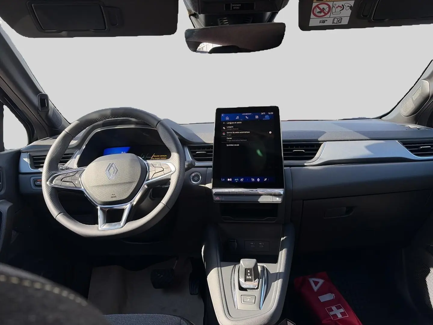 Vue avant de l'habitacle du Renault Symbioz noir étoile, avec volant multifonction et écran tactile vertical central.