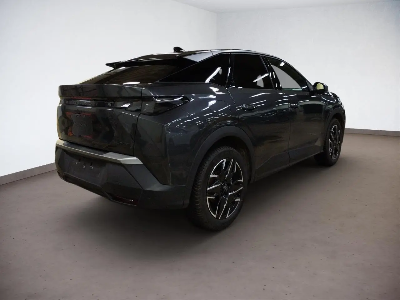 Volant compact cuir perforé noir avec badge GT au centre, tableau de bord et commandes tactiles du Peugeot 3008 Hybrid 2025.