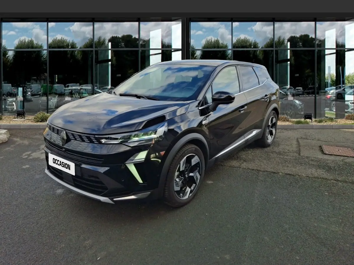 Renault Symbioz noir en 3/4 avant droit, avec phares LED et jantes au design moderne, stationné devant un bâtiment vitré.