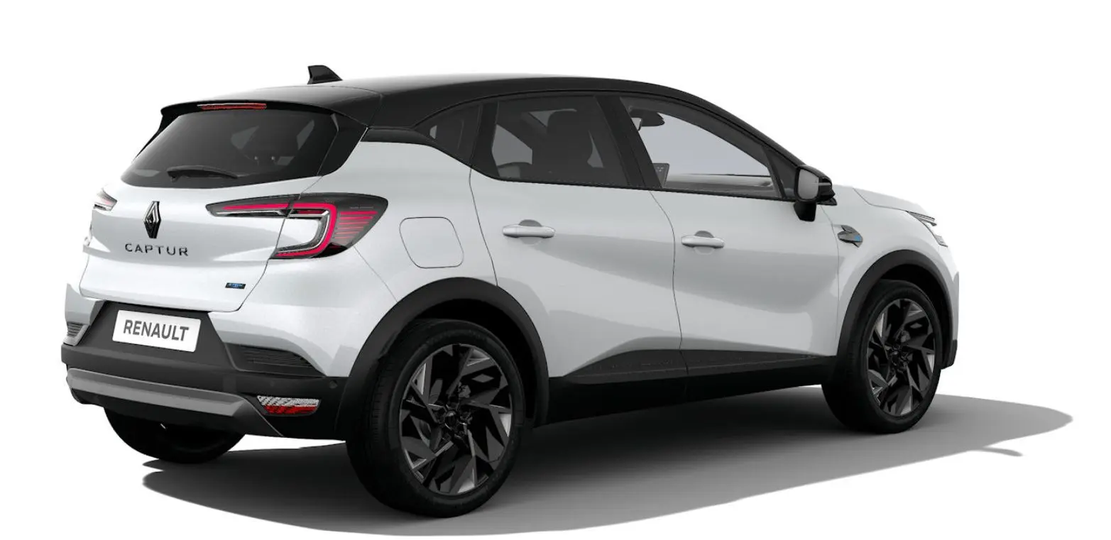 Renault Captur blanc nacré bi-ton vue 3/4 arrière droit avec toit noir et jantes noires stylisées.