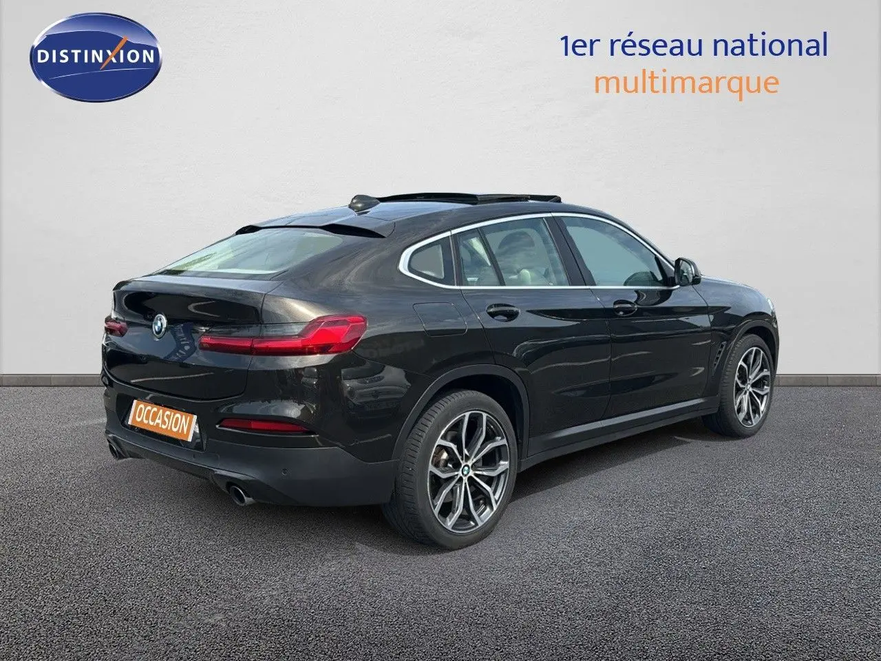 BMW X4 XDRIVE 30D 2019 en Sparkling Storm Métal, vue 3/4 arrière droit avec jantes alliage et feux LED.