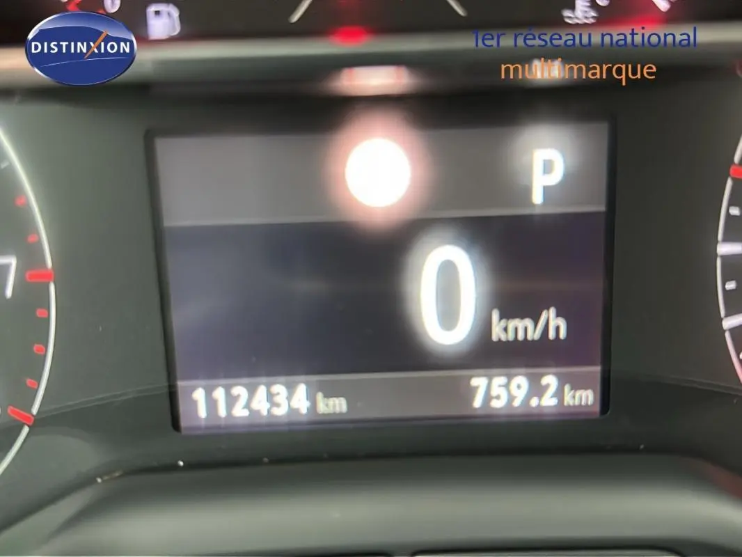 Affichage numérique du tableau de bord de l'Opel Grandland X gris clair, indiquant 0 km/h et 112434 km au compteur.