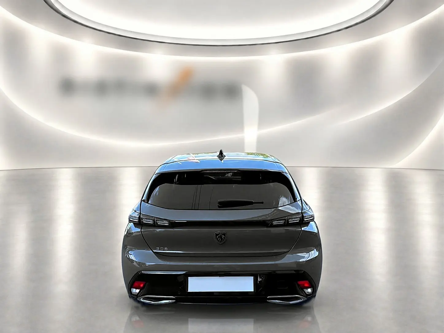 Vue arrière d'une Peugeot 308 gris selenium 2025 avec feux LED et double sortie d'échappement chromée.