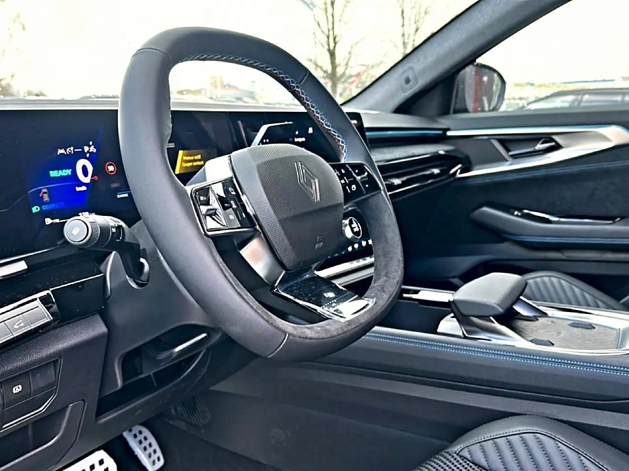 Intérieur Renault Austral 2026 vu côté conducteur, volant multifonction cuir et tableau de bord numérique.