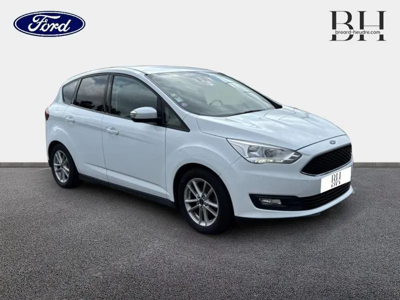 Ford C-MAX blanc glacier en 3/4 avant droit, avec jantes alu et vitres arrière surteintées.