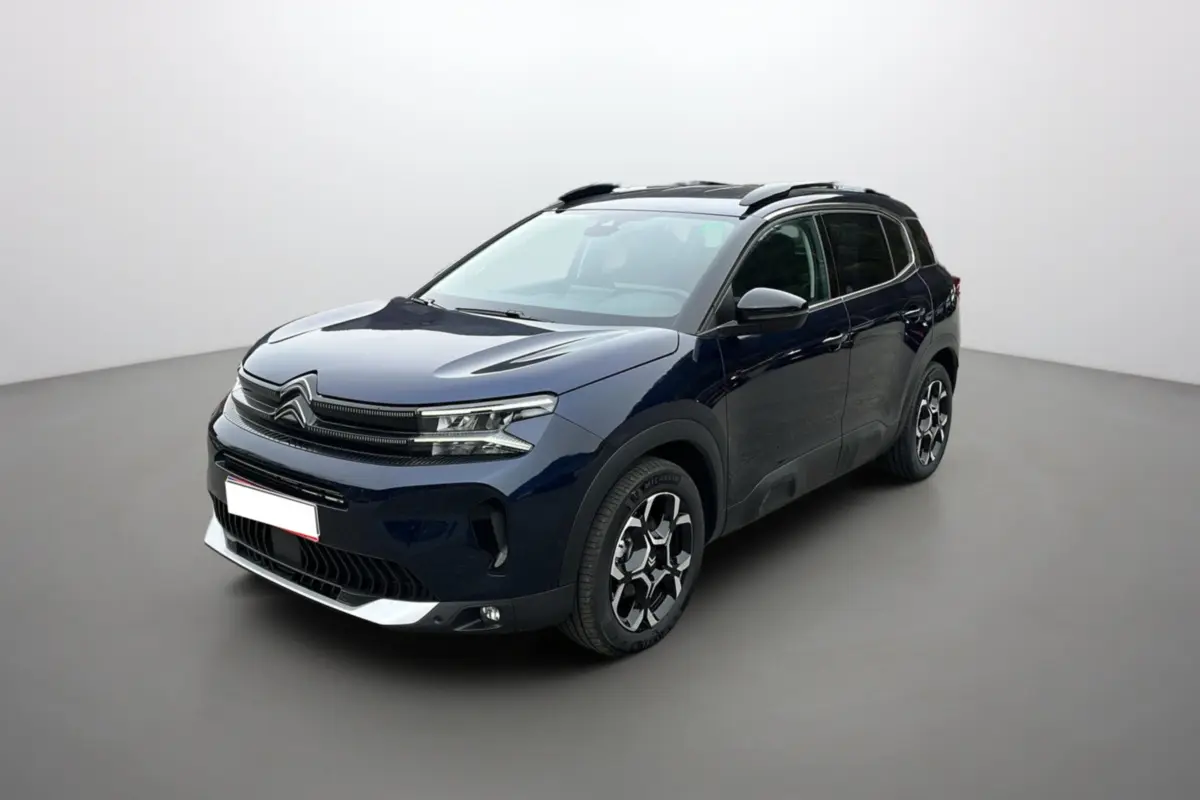 Citroën C5 Aircross Hybrid 145 E-DSC6 Max bleu Eclipse en 3/4 avant droit avec barres de toit et jantes alu 18 pouces.