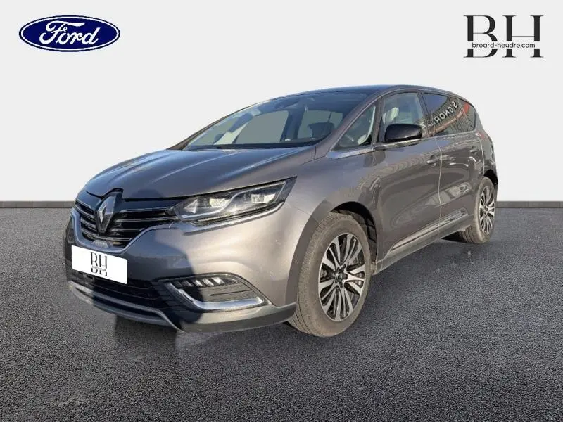 Renault Espace gris Cassiopée en 3/4 avant droit, mettant en valeur ses phares LED et jantes alliage distinctives.