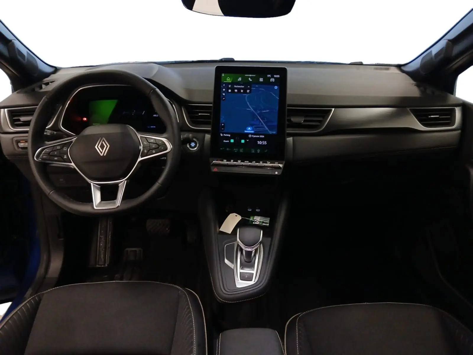 Vue intérieure frontale du tableau de bord du Renault Symbioz E-Tech Full Hybrid 145 Iconic 2025 avec écran tactile vertical.
