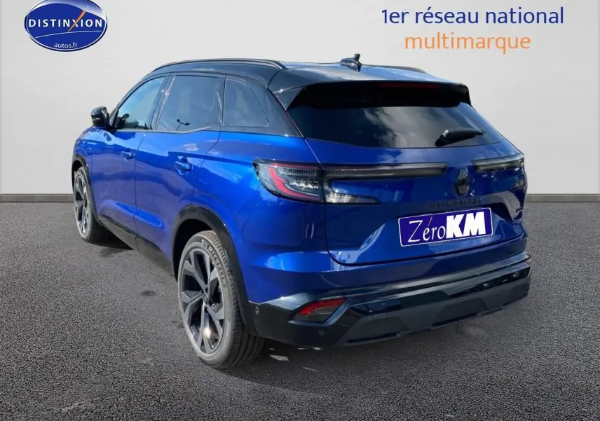 Vue 3/4 arrière droite du Renault Austral bleu iron avec toit noir et jantes aluminium.