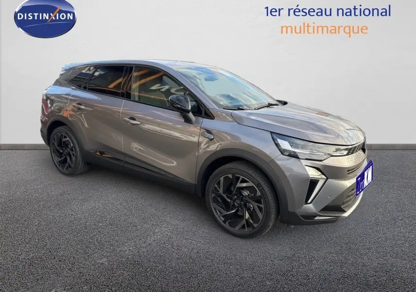 Renault Symbioz 2024 gris Cassiope en 3/4 avant droit avec jantes noires et lignes modernes marquées.
