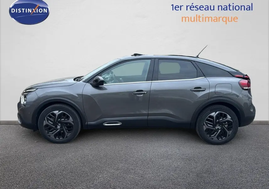 Citroën C4 PureTech 130ch gris avec toit noir, vue profil côté gauche, jantes noires distinctives.