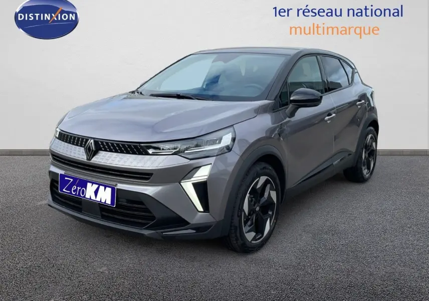 Renault Captur 2025 gris Cassiopée métal avec toit noir, vue 3/4 avant droit mettant en valeur ses phares LED et jantes biton.