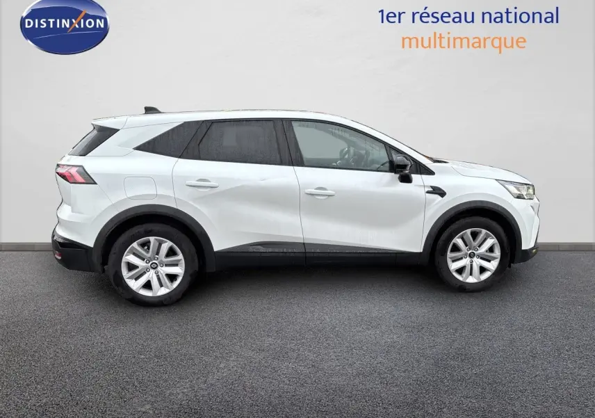 Profil droit d'un Renault Symbioz blanc nacré, SUV hybride 2025 avec jantes alliage et lignes modernes.