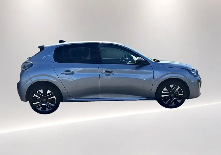 Peugeot 208 1.2 100 Allure gris Artense vue de profil côté gauche avec jantes alliage et vitres teintées.