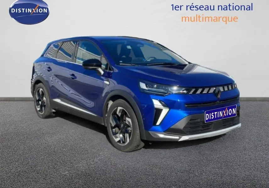 Renault Symbioz bleu iron metal en 3/4 avant droit, avec calandre lumineuse et jantes modernes.