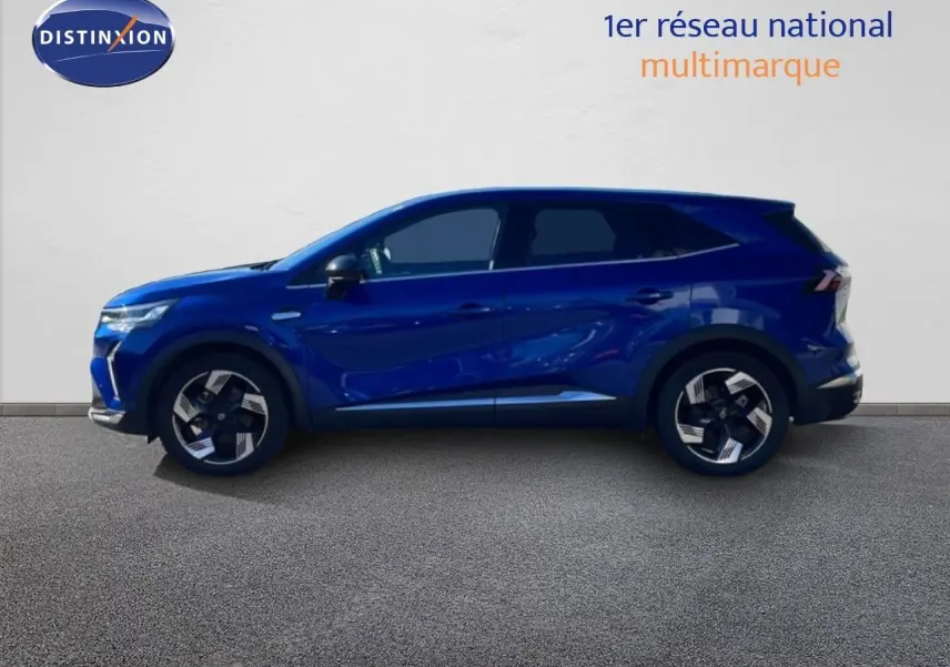 Profil droit du Renault Symbioz 2025 bleu Iron Metal avec jantes alliage et lignes sculptées.