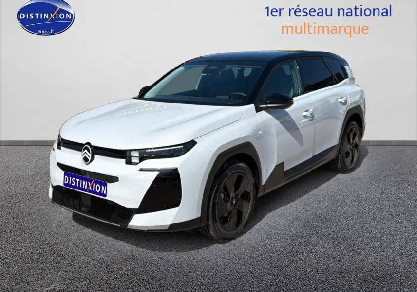 Vue 3/4 avant d'un Citroën C5 Aircross blanc avec toit noir et jantes alliage noires sur fond neutre.