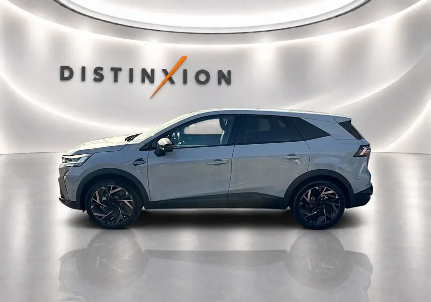 Renault Symbioz gris rafale en profil droit, SUV hybride 2026 avec jantes alu noires et toit contrasté.