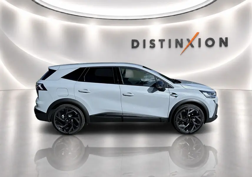 Renault Symbioz 2026 gris rafale en profil droit, avec jantes noires et vitres arrière surteintées.