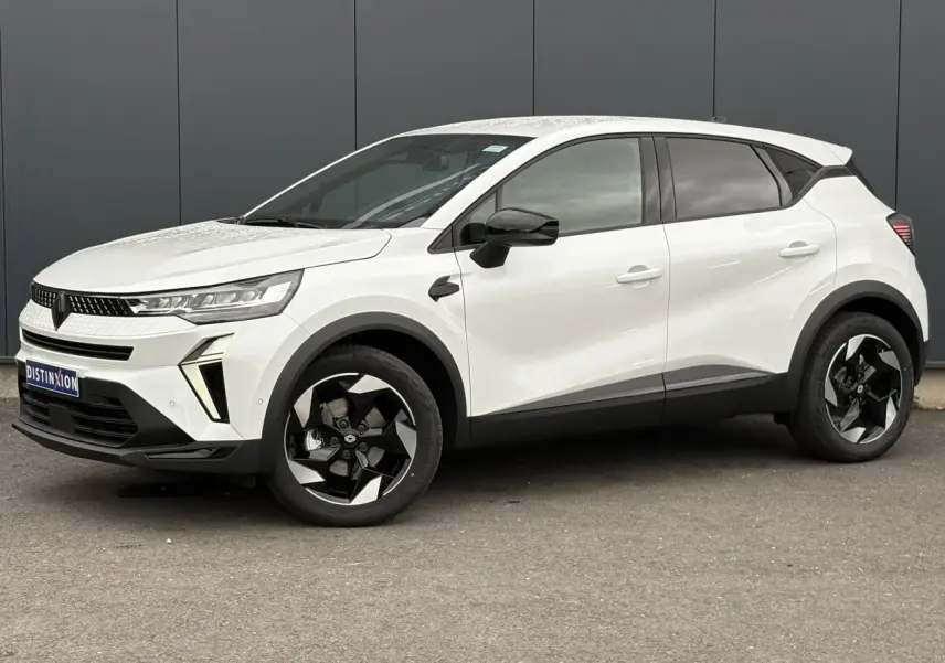 Vue de profil droit du Renault Captur blanc nacré 2026 avec jantes noires et détails noirs contrastants.