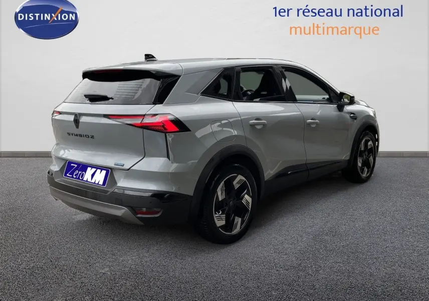 Vue 3/4 arrière droite du Renault Symbioz gris Rafale métal avec feux LED et jantes noires distinctives.