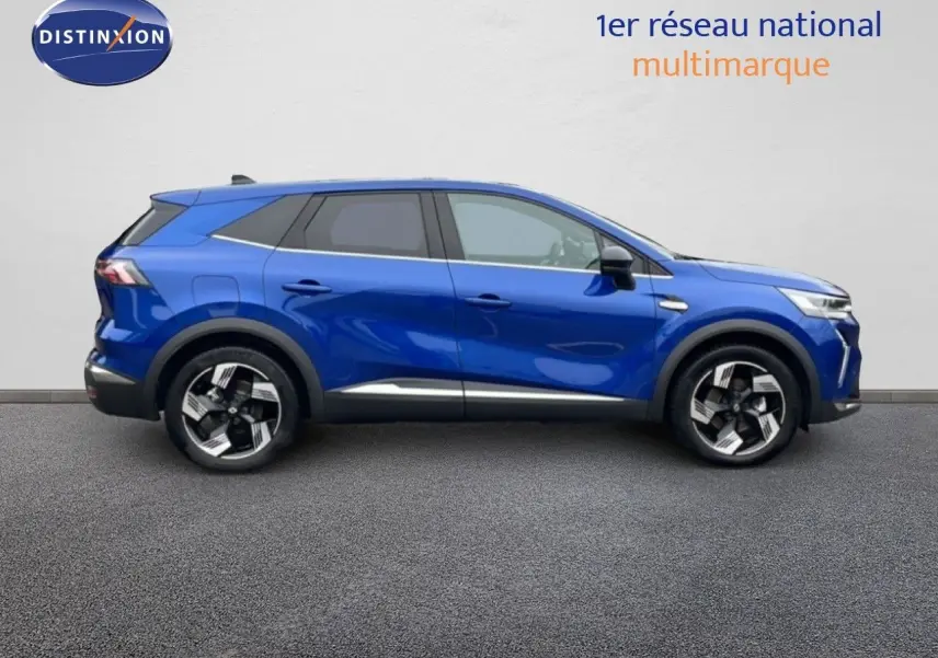 Profil droit d’un Renault Symbioz E-Tech Full Hybrid 145ch Iconic bleu Iron Metal avec jantes bi-ton et détails noirs.