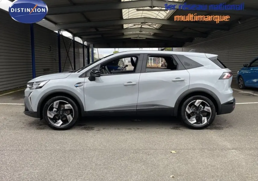 Profil droit du Renault Symbioz 2026 gris Rafale Métal avec jantes noires et détails modernes.