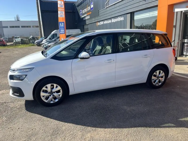 Citroën Grand C4 Spacetourer blanc Banquise vu de profil côté gauche, avec jantes alliage et vitres teintées.