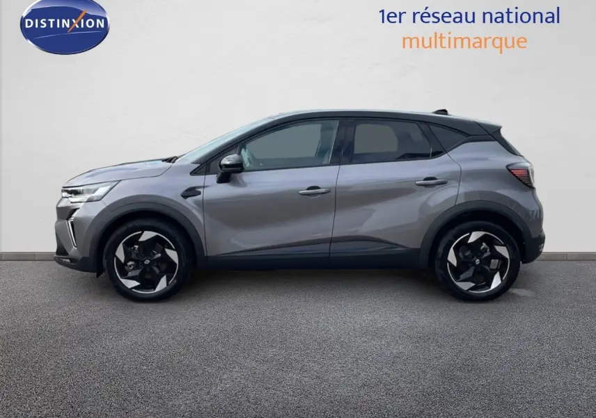 Profil côté gauche du Renault Captur E-Tech hybride gris Cassiopée avec toit noir, roues alliage et lignes modernes.