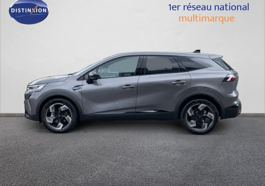 Renault Symbioz gris cassiopée métal en profil droit, SUV hybride avec jantes noires et détails modernes.