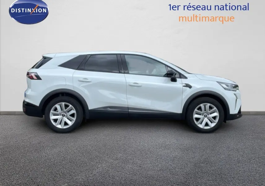 Profil droit du Renault Symbioz gris rafale métal 2025, SUV hybride avec jantes argentées et vitres teintées.