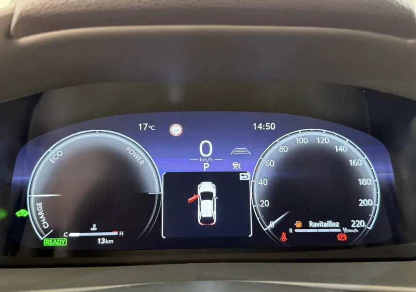 Affichage numérique du combiné d'instruments du Toyota C-HR 1.8 Hybride, avec vitesse à zéro et alertes visibles.