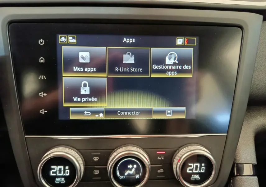 Écran tactile central du tableau de bord du Renault Kadjar Business gris foncé, affichant le menu des applications.