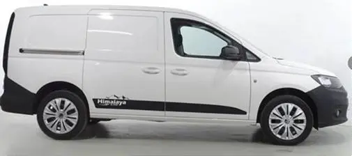 Profil droit d'un Volkswagen Caddy Maxi blanc 2025 avec logo Himalaya soulignant sa garde au sol rehaussée.