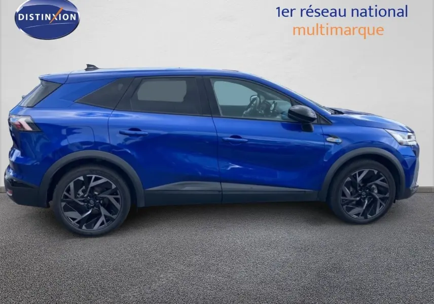 Profil droit du Renault SYMBIOZ E-TECH Full Hybrid 145ch en bleu Iron Metal avec jantes noires et détails noirs contrastants.