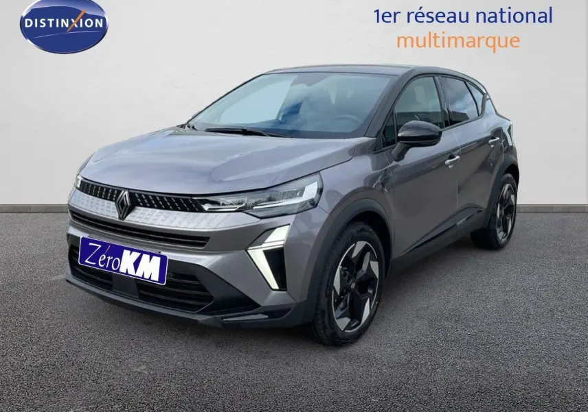 Renault Captur E-Tech hybride gris cassiopée métal avec toit noir, vue 3/4 avant droit mettant en valeur ses phares LED et jantes biton.